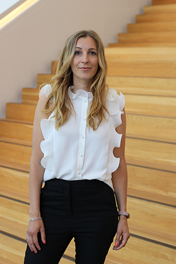 Sarah Lindholm standing in front of stairs